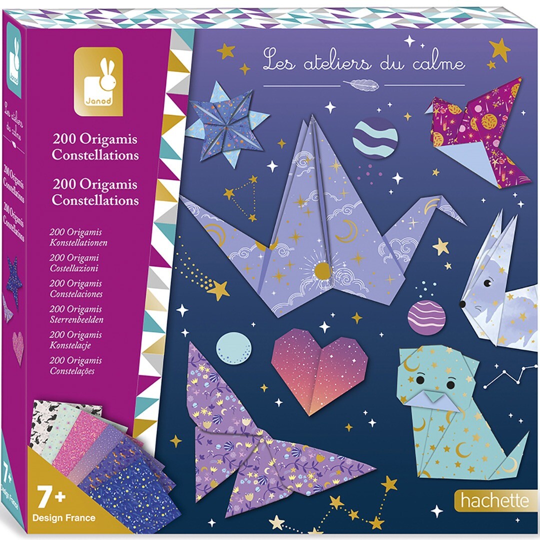 Janod origami set verpakking met diverse gevouwen figuren en sterrenbeeldenpatronen.
