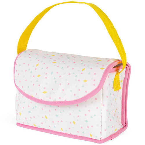 De Janod poppen verzorgingstas is gesloten en heeft een wit patroon met roze en gele accenten en een geel handvat.