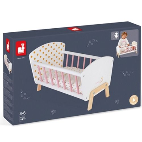 De verpakking van het Janod houten poppenbed met gouden stippen.