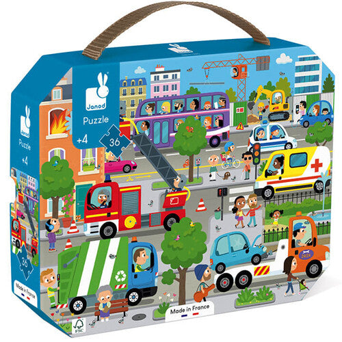 Janod puzzelverpakking met een illustratie van een drukke stad vol voertuigen en mensen.