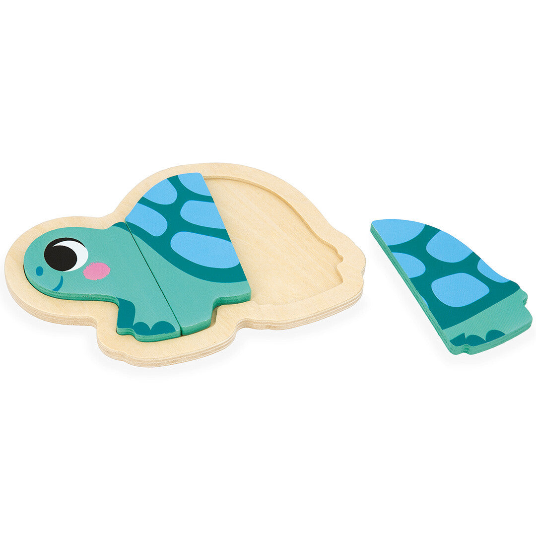 Janod houten puzzel van een blauwe schildpad, deels in elkaar gezet met een los stuk ernaast.