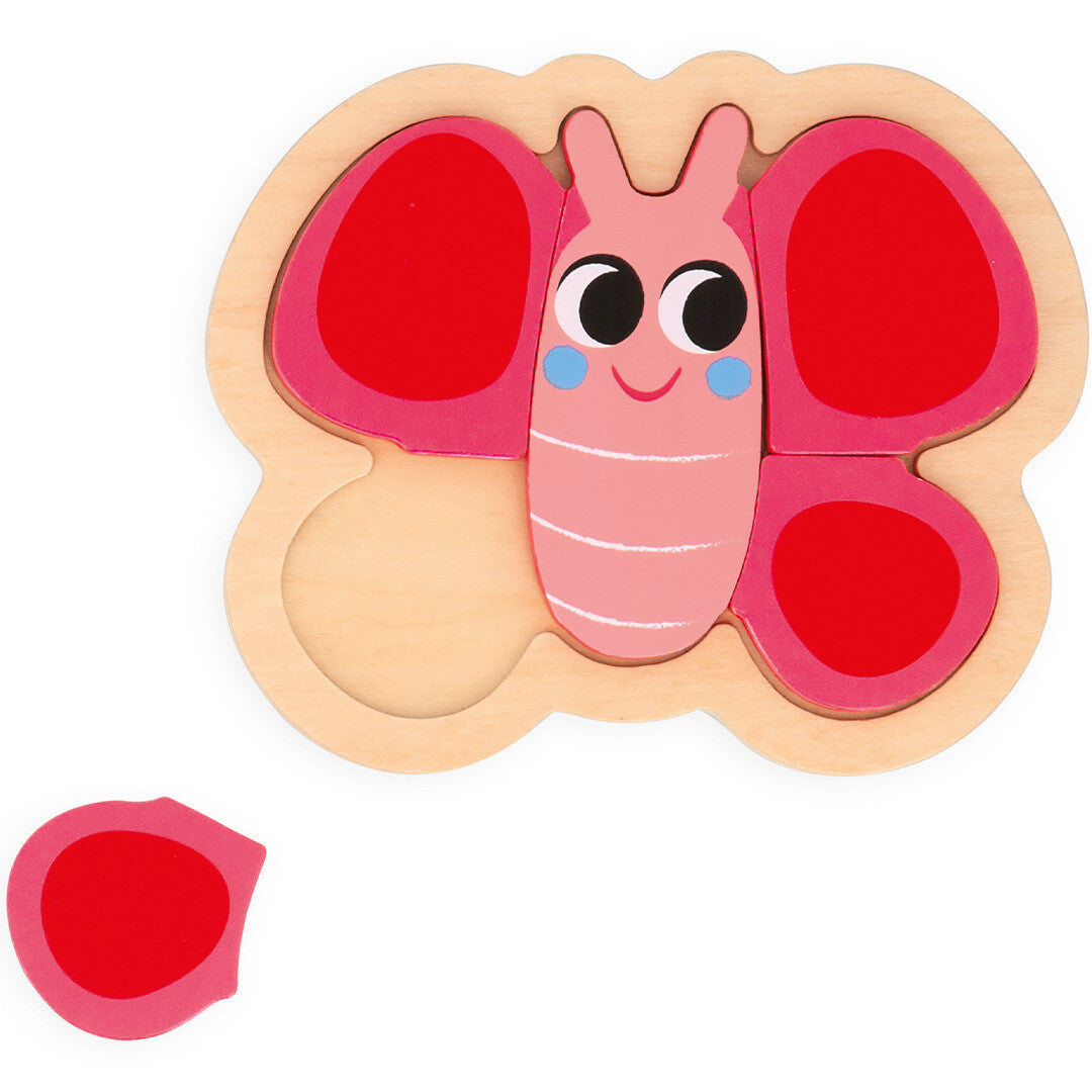 Janod houten puzzel van een roze vlinder, deels in elkaar gezet met een los stuk ernaast.
