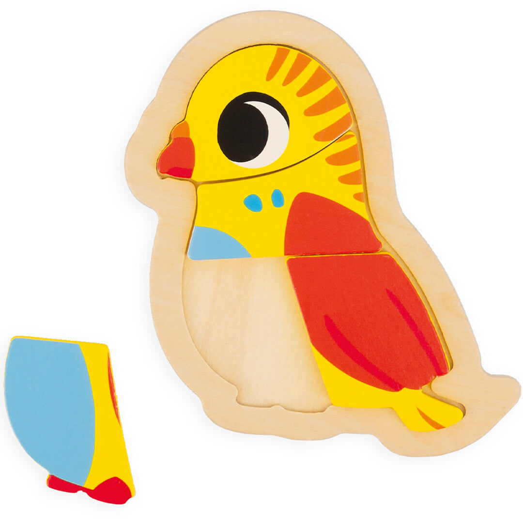 Janod houten vogelpuzzel, deels in de houten vorm met een los stuk ernaast.