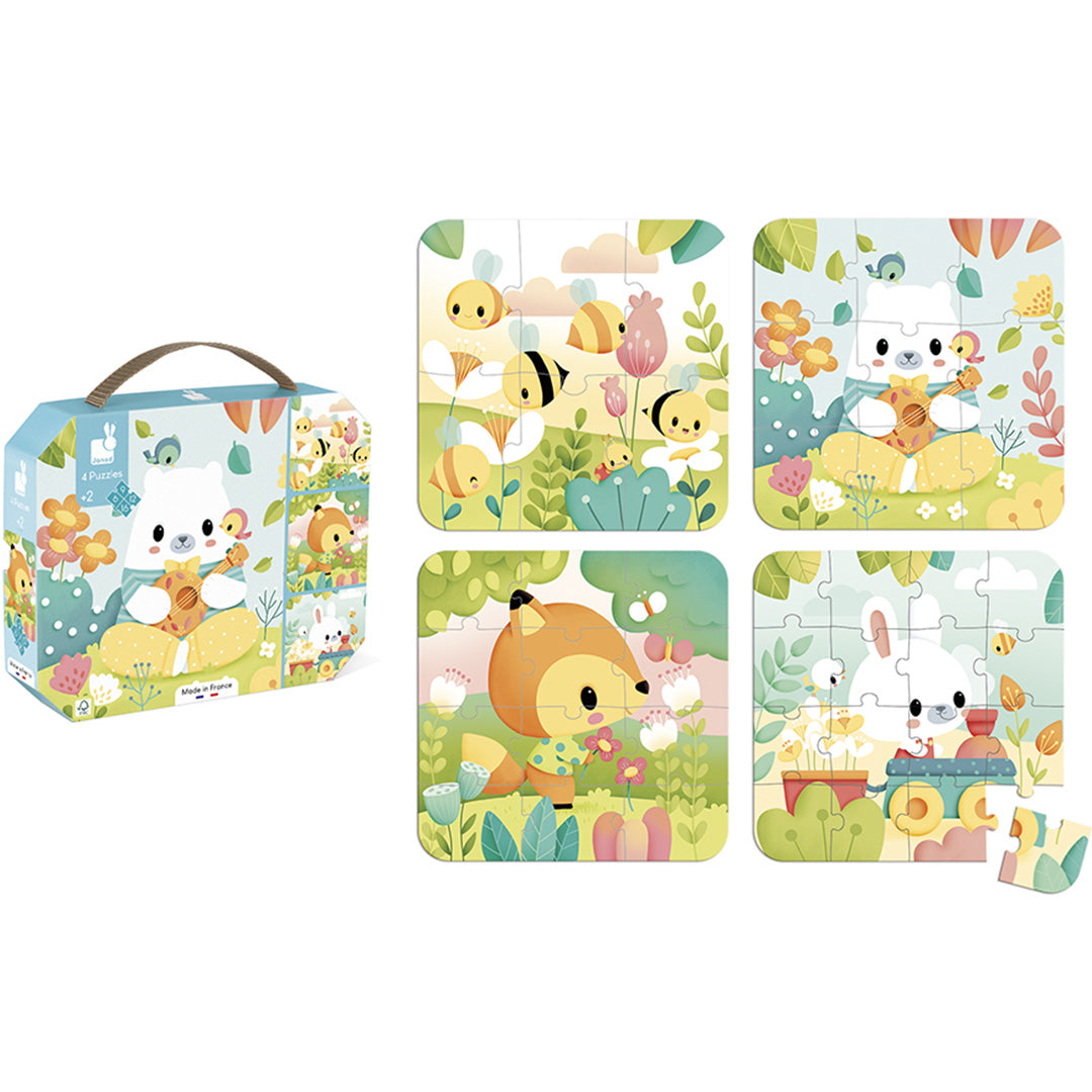 De Janod puzzelverpakking naast de vier complete kinderlegpuzzels met dieren en bloemen.