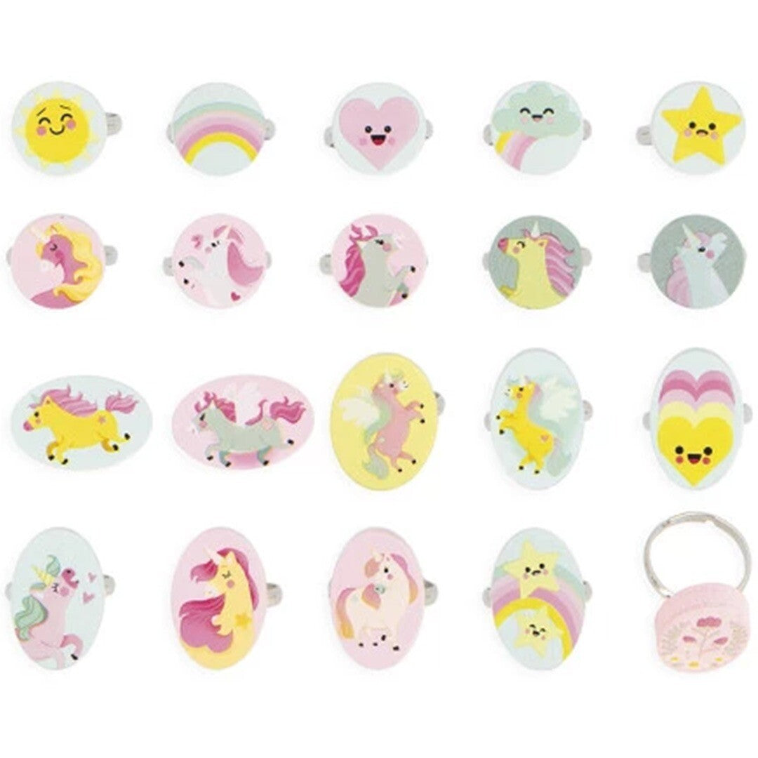 Een bovenaanzicht van 20 Janod kinderringen met diverse eenhoorn-, regenboog-, hart-, ster- en emoji-ontwerpen.