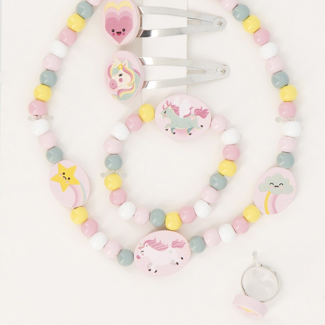 De Janod eenhoorn sieradenset met ketting, armband, ring en twee haarspeldjes, van bovenaf gezien.