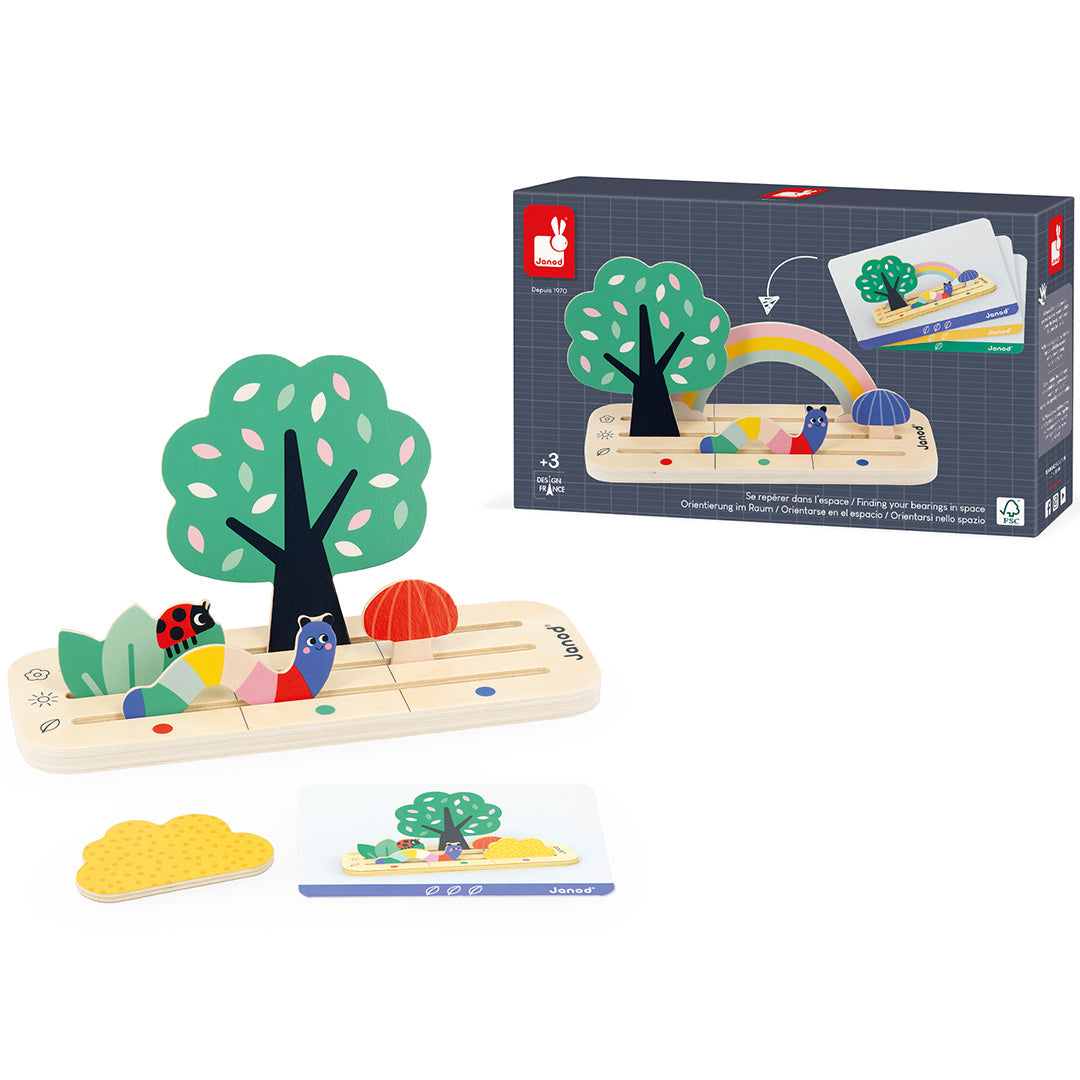 De verpakking van het Janod houten sorteerspel 'vind je plaats in de tuin' met het speelgoed ernaast.