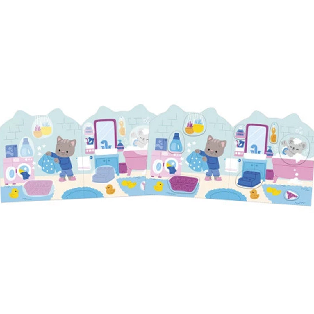 Demonstratie van een uitgevouwen scène uit het Janod stickerboek met een kat die de was doet in een badkamer.
