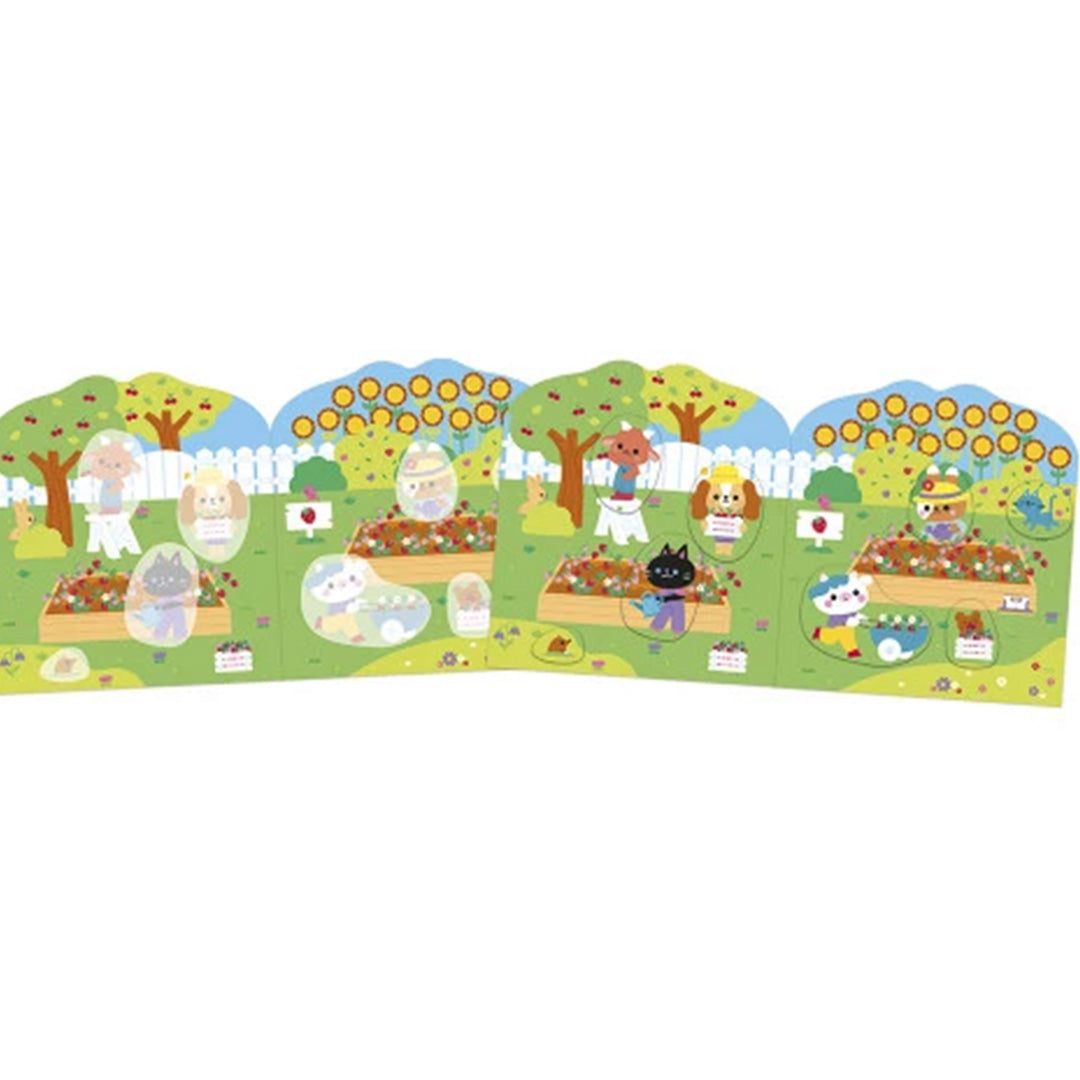 Een uitgevouwen scène uit het Janod stickerboek met dieren in een moestuin.