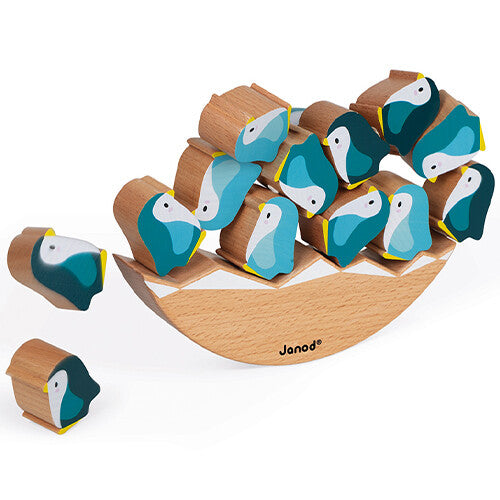 Janod WWF houten evenwichtsspel met pinguïns, waarbij enkele pinguïns naast de houten basis liggen.