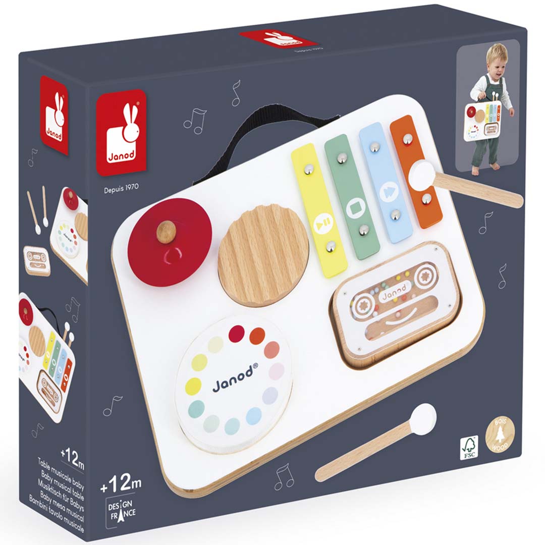 De verpakking van de Janod muziektafel confetti, een houten muziekspeelgoed voor baby's.