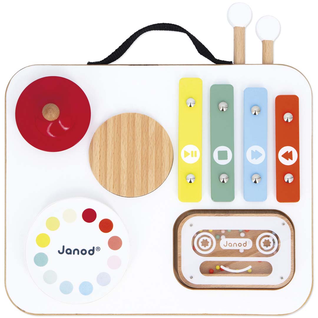 Janod muziektafel confetti, een wit houten babyspeelgoed met xylofoon, cymbaal, draaischijf en cassette shaker, van bovenaf gezien.