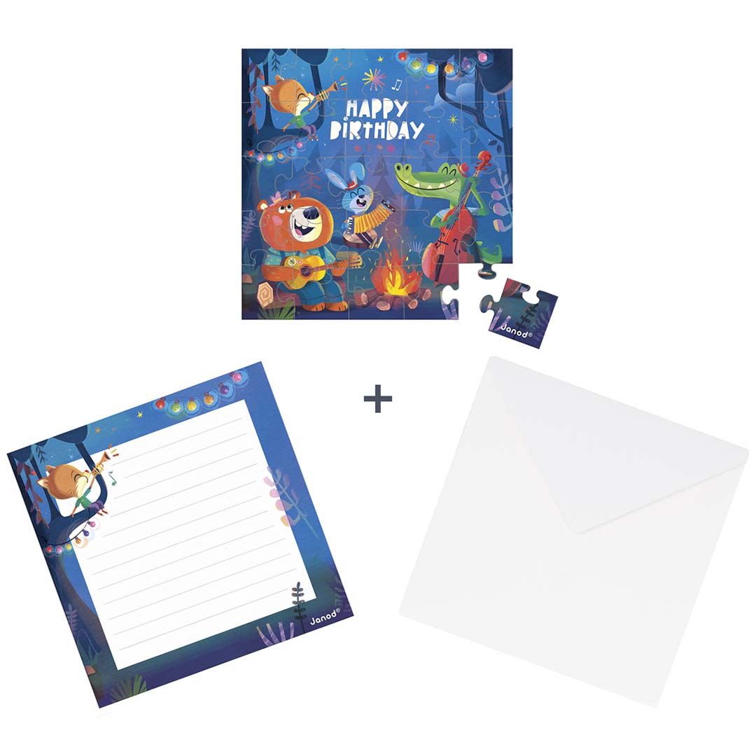 Janod puzzelkaart met losse puzzelstukjes, een bijpassend blanco schrijfvel en een witte envelop.