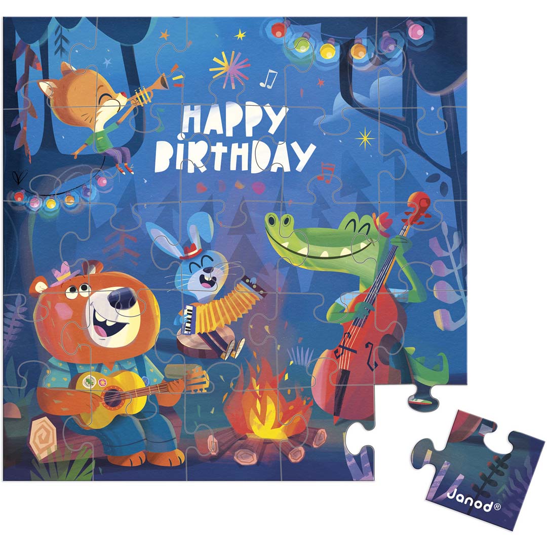 Janod puzzelkaart met bosdieren die muziek maken rond een kampvuur en de tekst "Happy Birthday", met één los puzzelstukje.