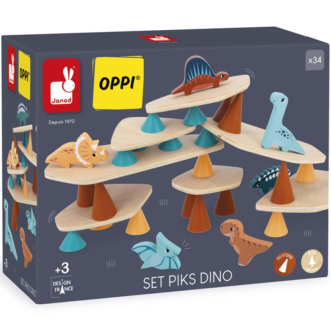 De verpakking van het Janod dino stapelspel, een donkergrijze doos met een afbeelding van het opgebouwde spel en de merklogo's.