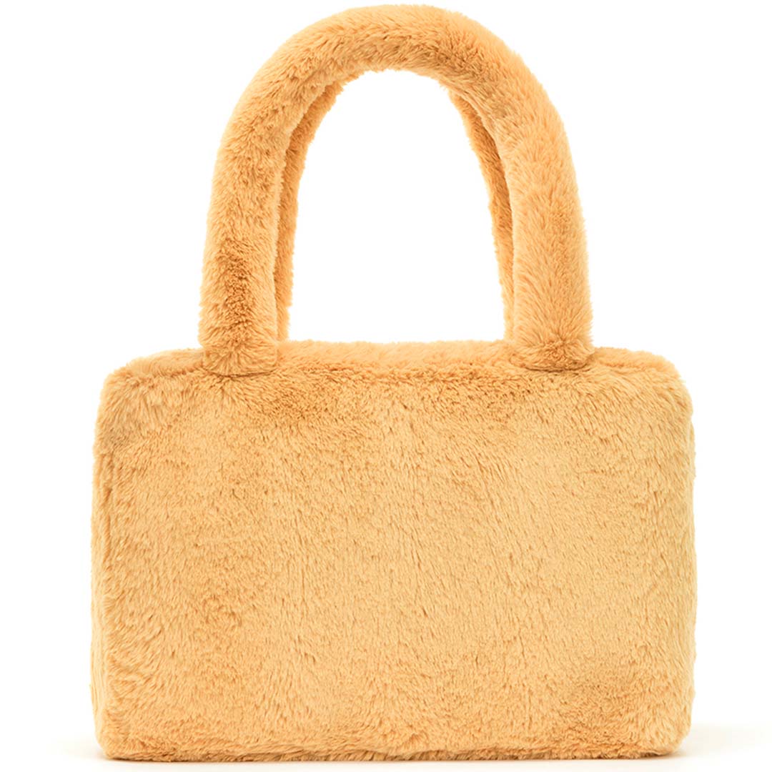 Achteraanzicht van de effen beige pluche handtas.