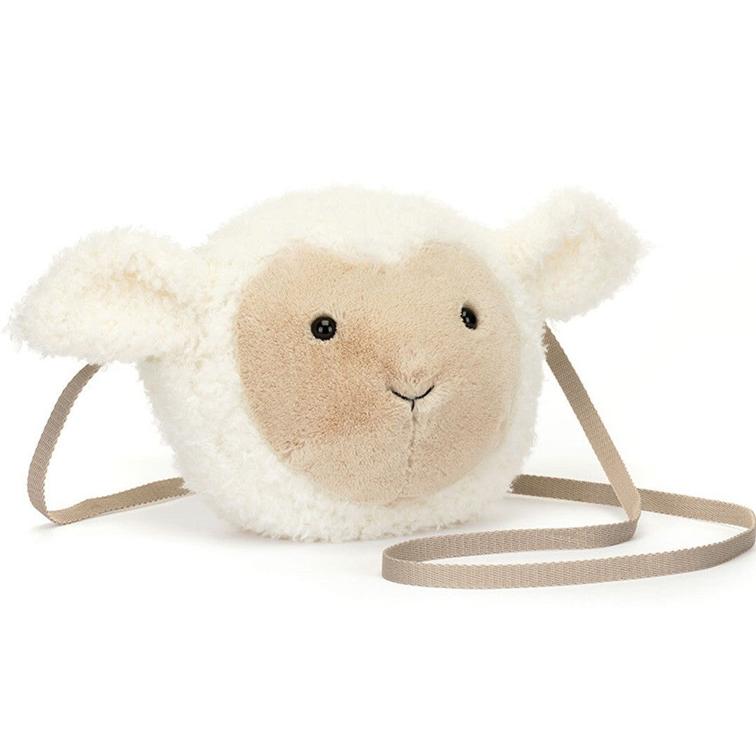 Jellycat pluchen kindertas in de vorm van een wit lam, schuin van voren gefotografeerd.