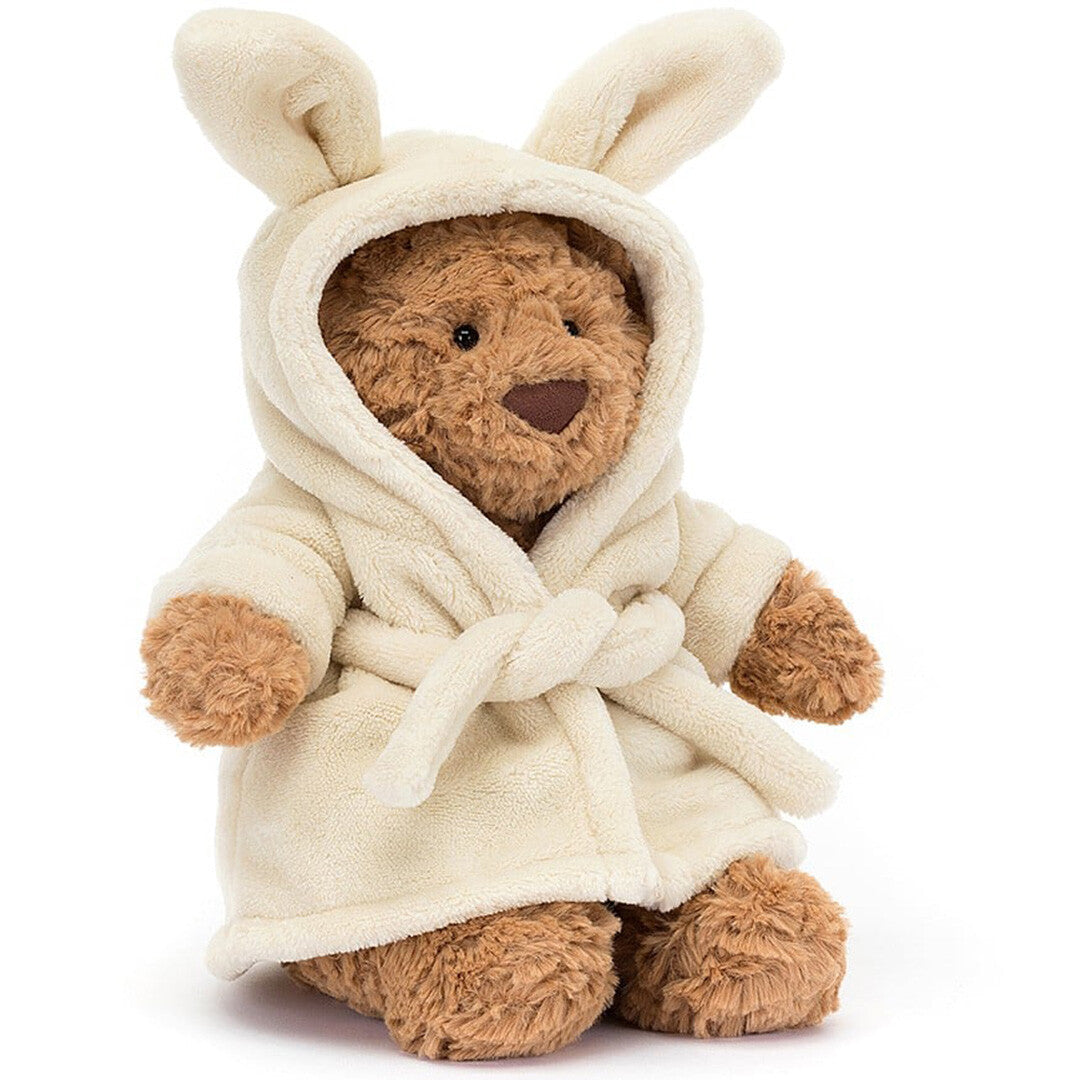 Jellycat knuffelbeer Bartholomew in een crèmekleurige badjas met konijnenoren.