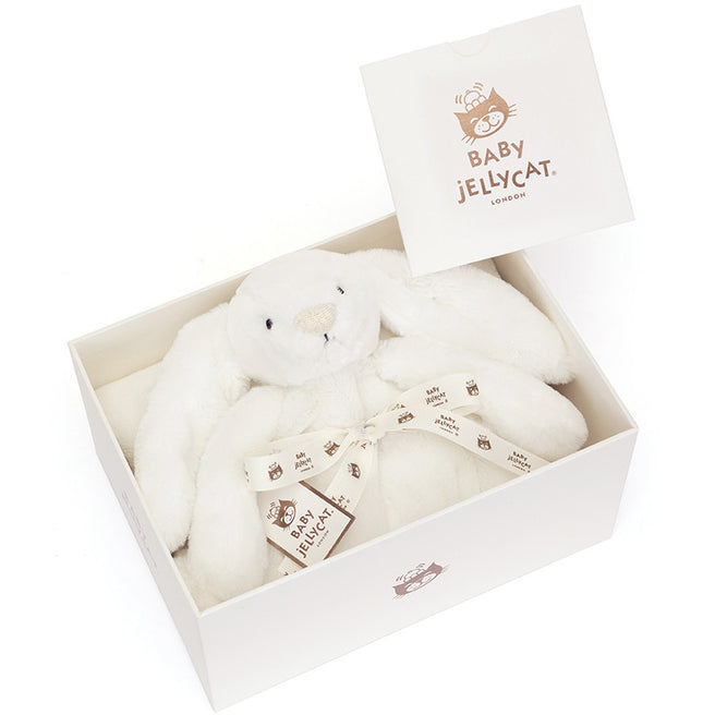 Baby Jellycat knuffeldekentje bashful konijn in een open witte geschenkverpakking.