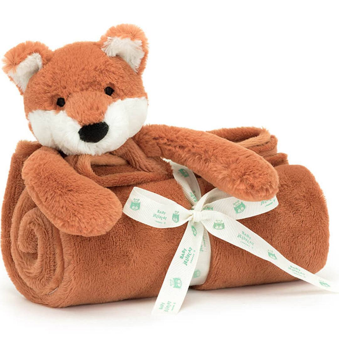 Jellycat knuffeldekentje in de vorm van een vos, opgerold en vastgebonden met een lint.