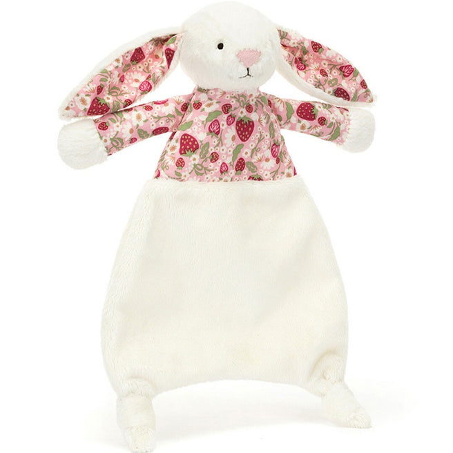 Jellycat knuffeldoek in de vorm van een wit konijn met een roze lijfje met aardbeienpatroon, van voren gezien.