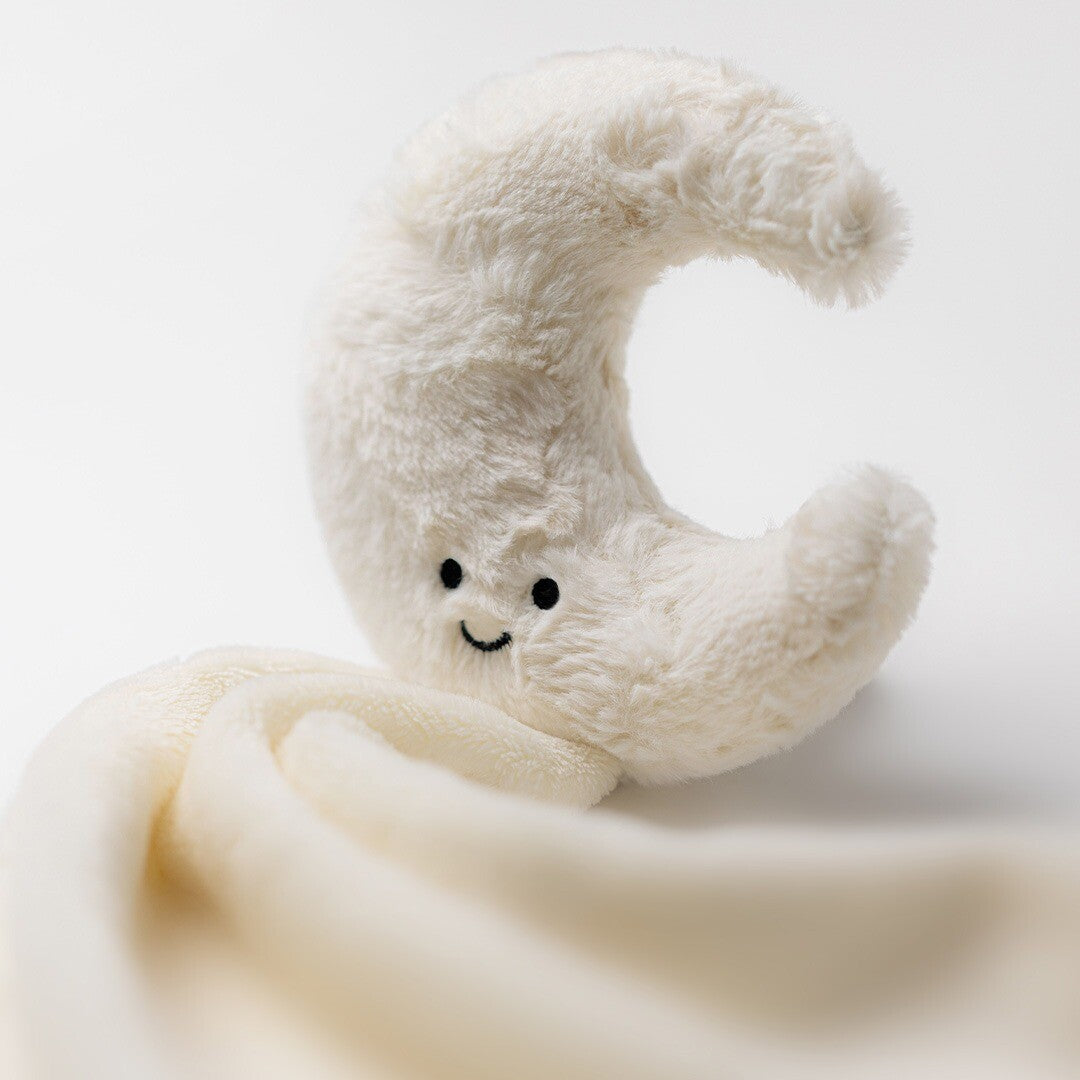 Close-up van de Jellycat pluchen knuffeldoek met een beige maanhoofdje en een lachend gezichtje.