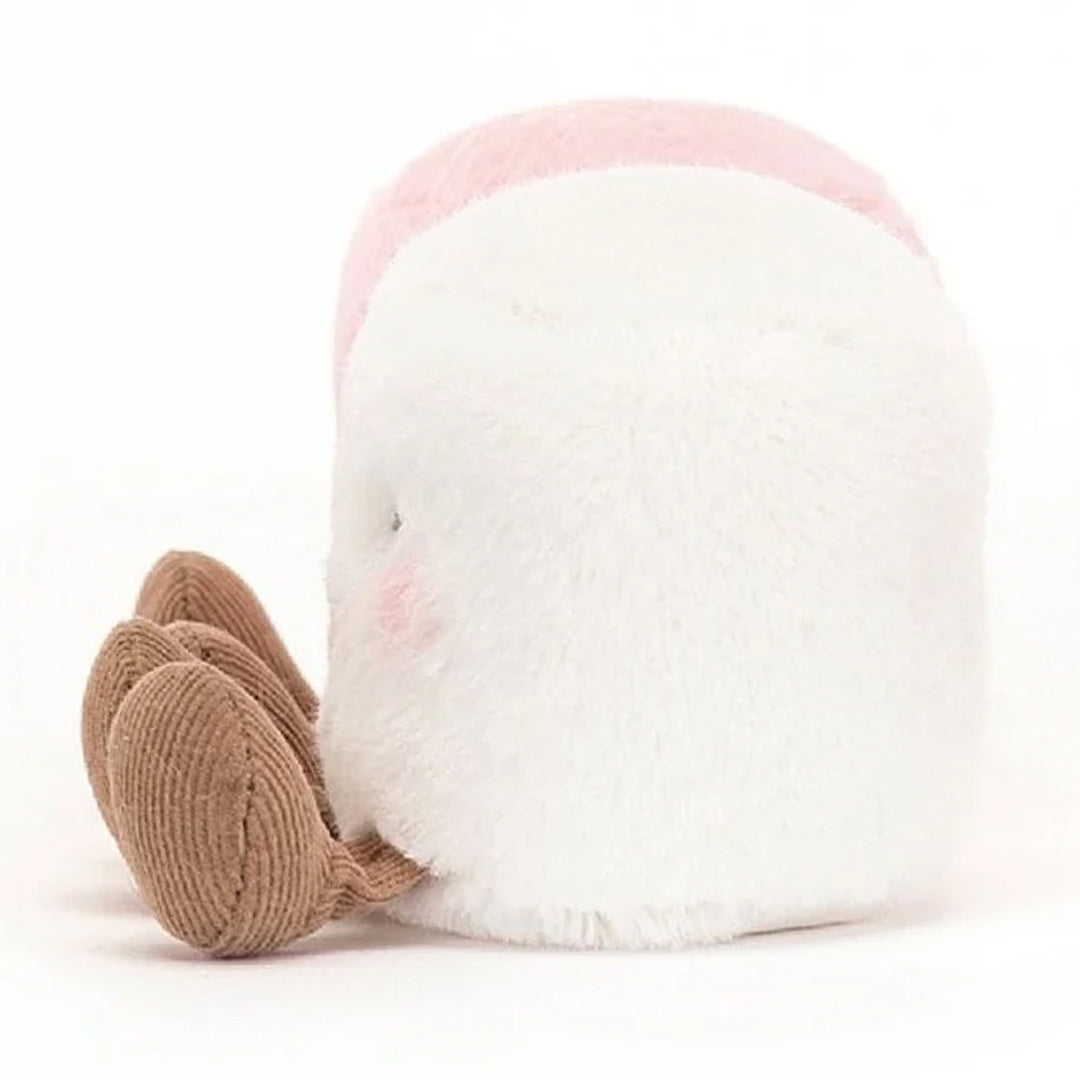 De achterkant van een witte pluchen marshmallow met bruine voeten, met een roze marshmallow erachter.