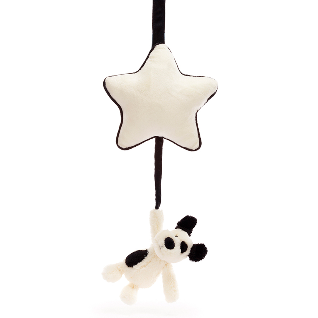 Jellycat babyspeelgoed muziekdoosje met een hangende beige ster en een puppy met zwarte vlekken.