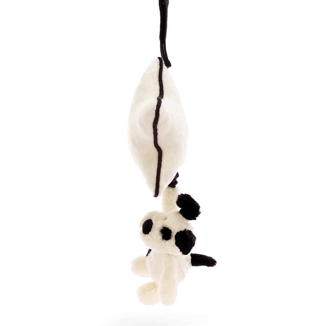 Zijaanzicht van het Jellycat babyspeelgoed muziekdoosje met de hangende beige ster en de puppy.