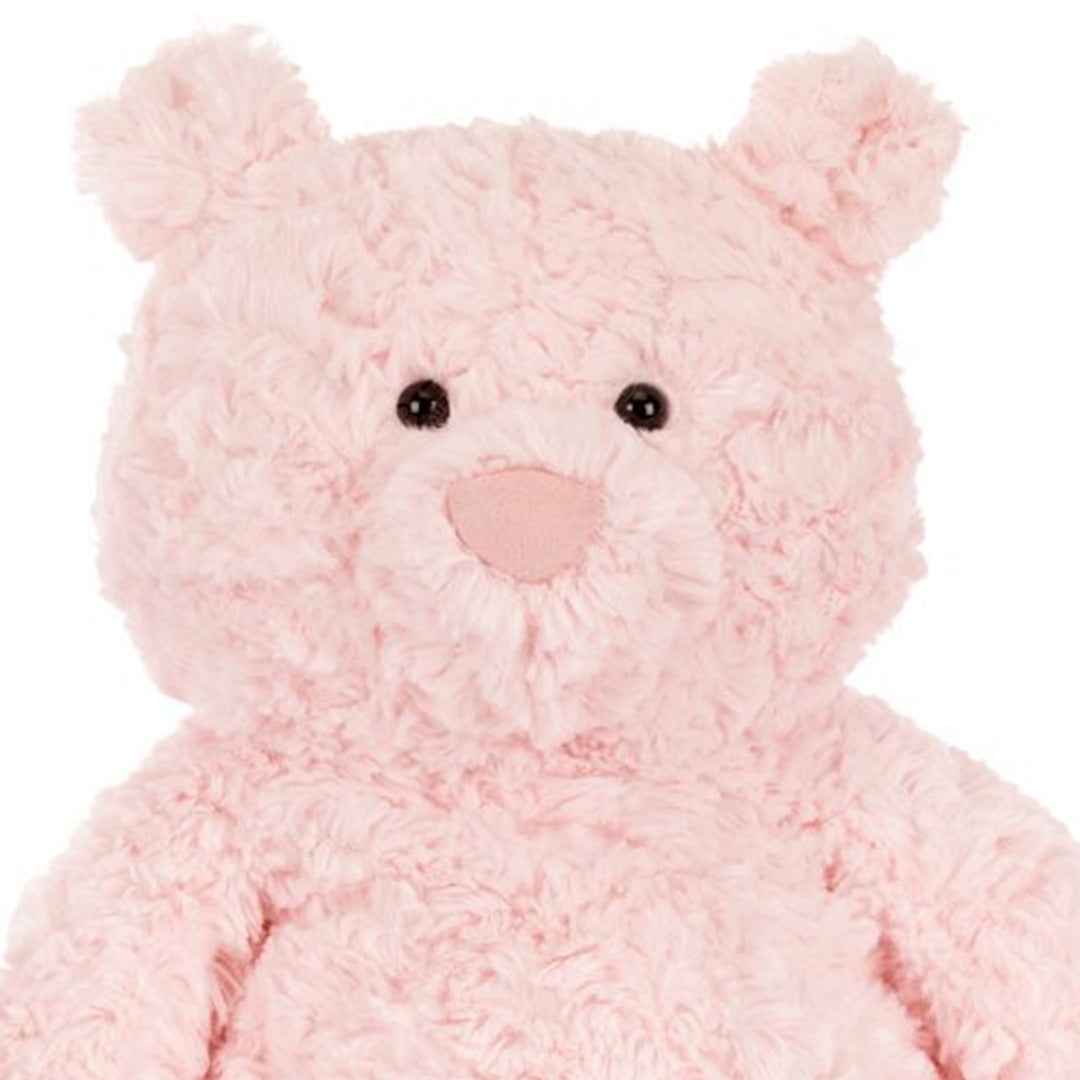 Detailopname van het gezicht van de Jellycat roze pluchen knuffelbeer Leola.