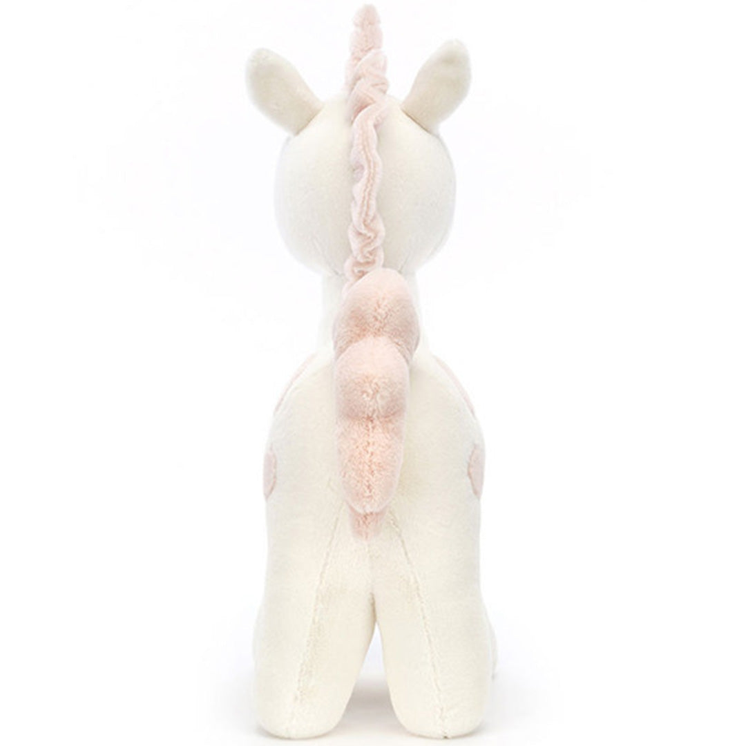 Jellycat pluchen eenhoorn met roze stippen, van achteren gefotografeerd.
