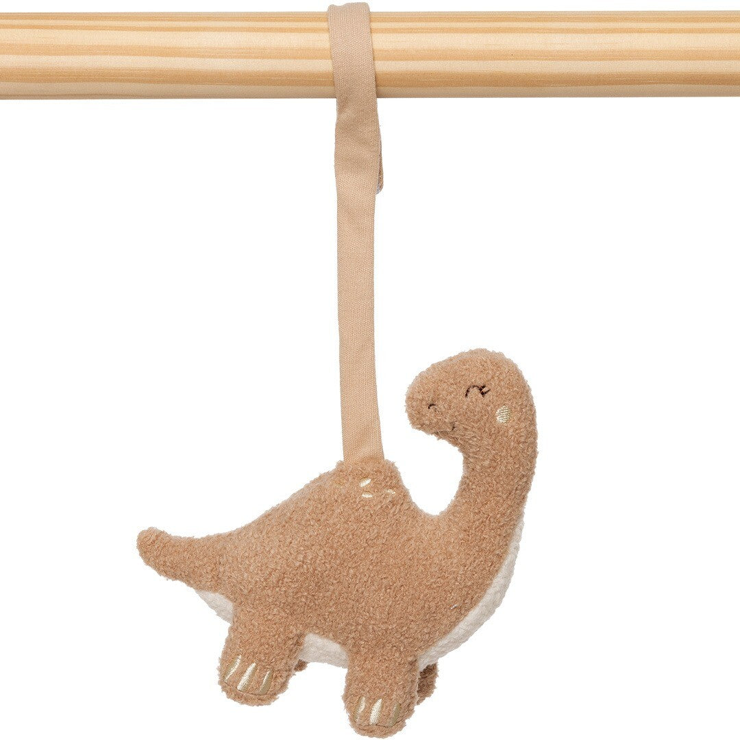 Close-up van het Jollein beige dinosaurus babygymspeeltje hangend aan een houten staaf.