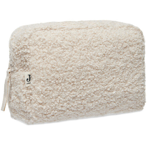 Jollein bouclé toilettas in naturel kleur, schuin van voren gefotografeerd.
