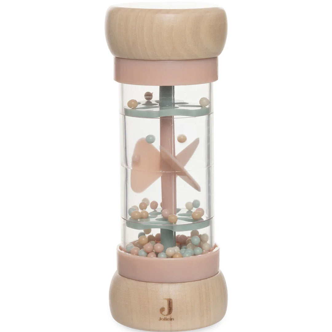 Jollein regenrammelaar met houten uiteinden, een transparante cilinder met roze en mintgroene kralen en een roze visje erin.