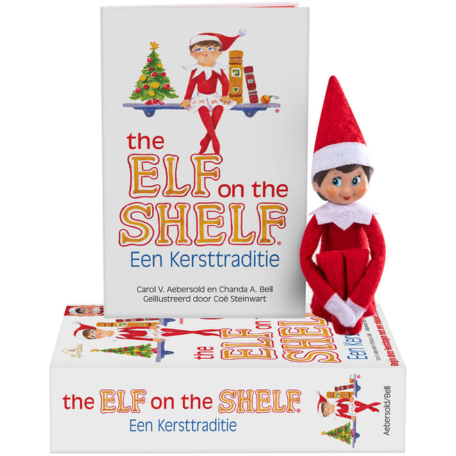 The Elf on the Shelf kerstboek en een rood elfje pop staan naast de verpakking.