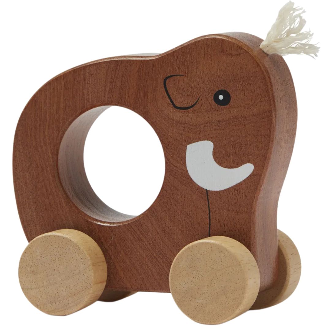 Kids concept houten duwfiguur in de vorm van een bruine mammoet met witte slagtanden en een gat in het midden.