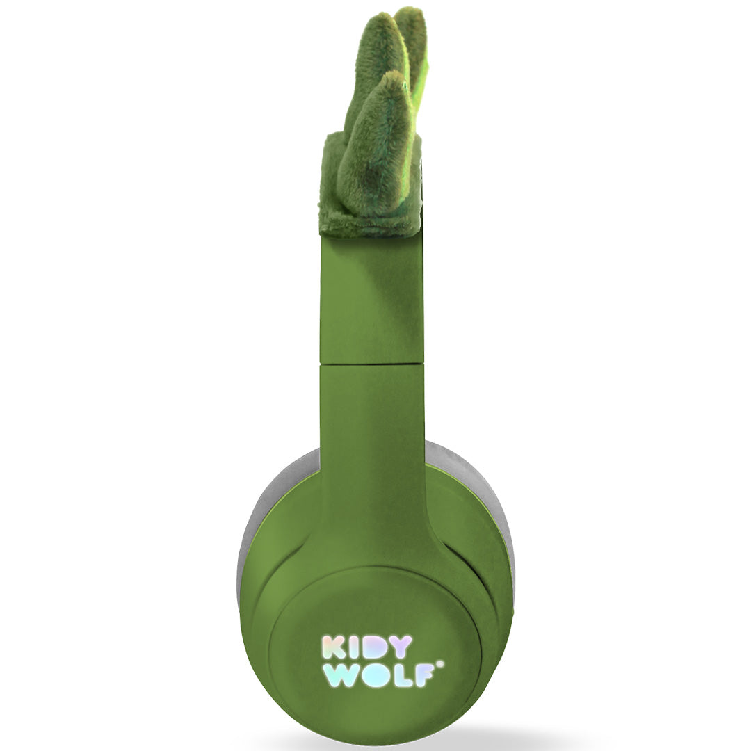 Zijaanzicht van de groene Kidywolf kinderkoptelefoon met dinosaurus-spikes.