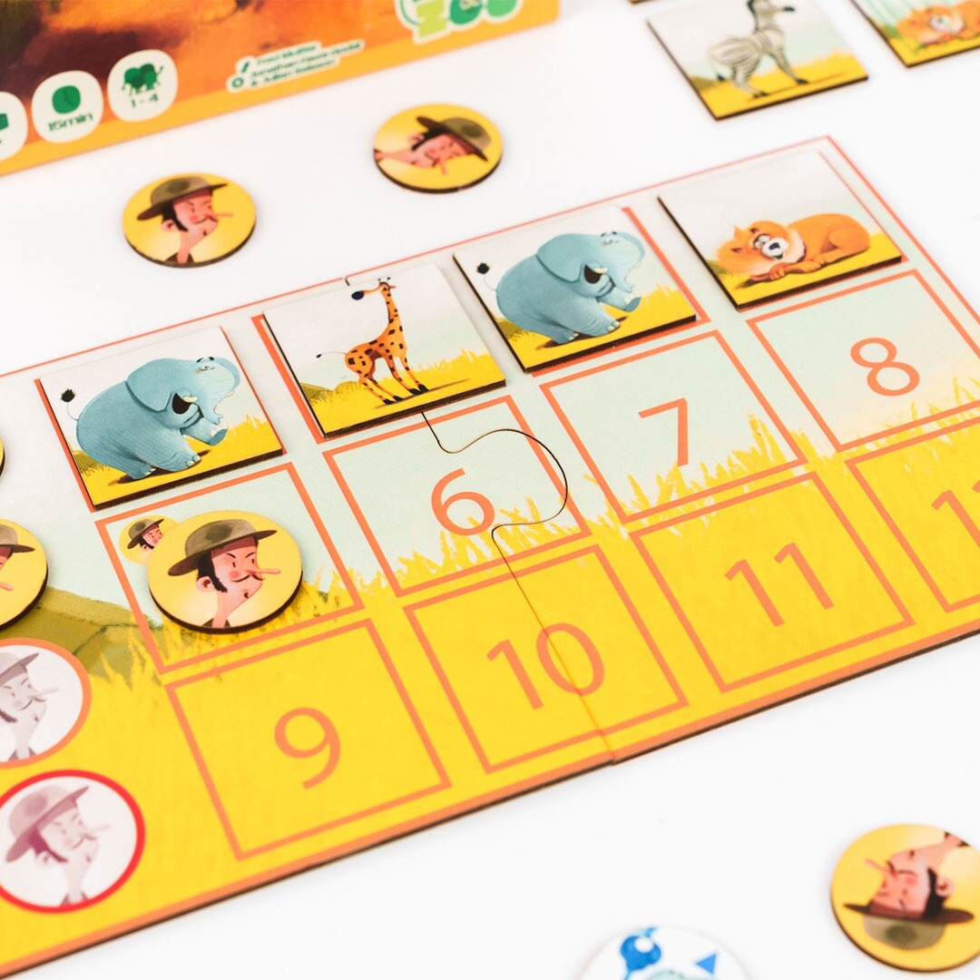 Close-up van het Mission Savane bordspel met fiches van olifanten, giraffen en personages op het speelbord.
