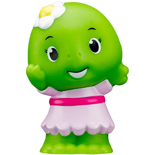 Detailfoto van een Klorofil groen dierenfiguur met een roze jurk en een bloem op het hoofd.