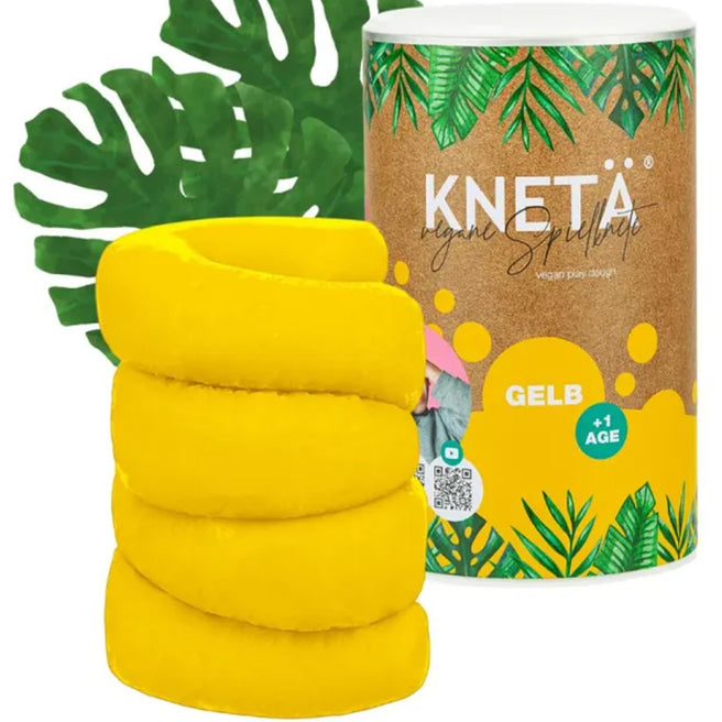 Knetä vegan speelklei in geel, met een stapel klei en de cilindervormige verpakking met bladeren.