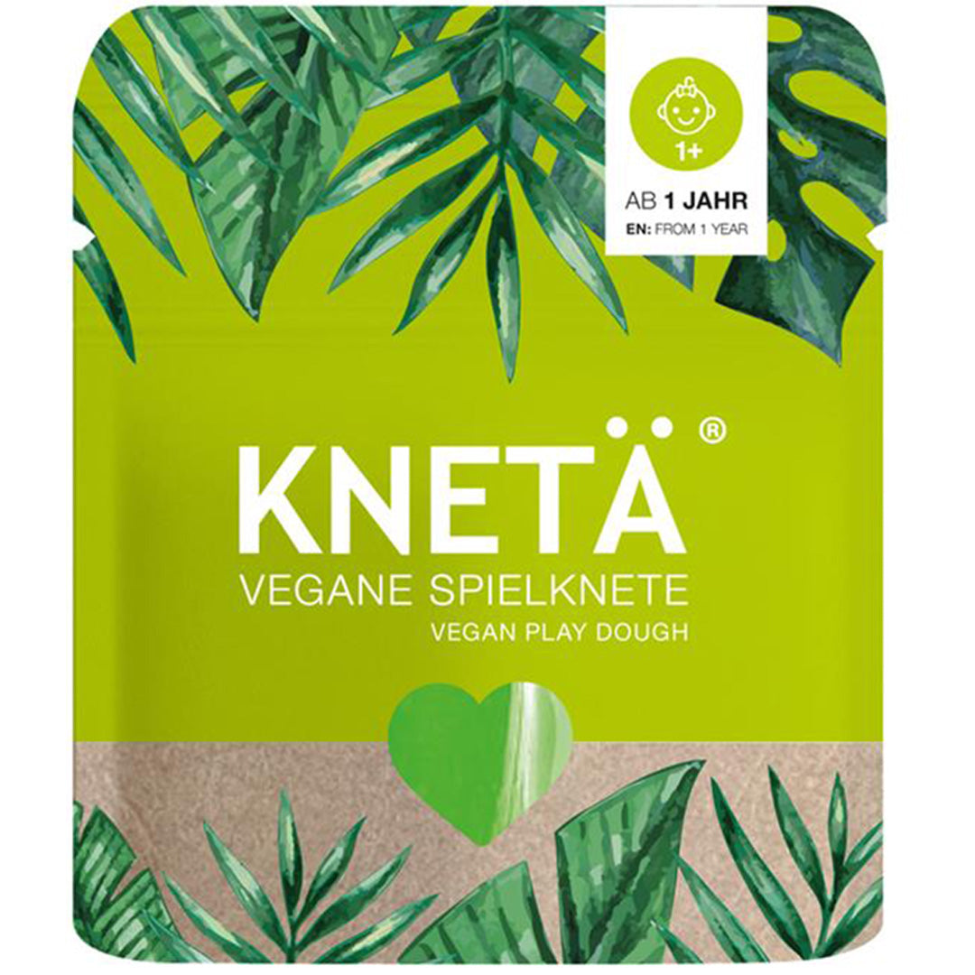 Verpakking van Knetä vegan speelklei met tropische bladeren en een groen hart.