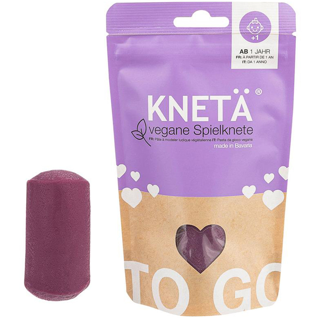 Knetä paarse vegan speelklei verpakking met een los stuk klei.