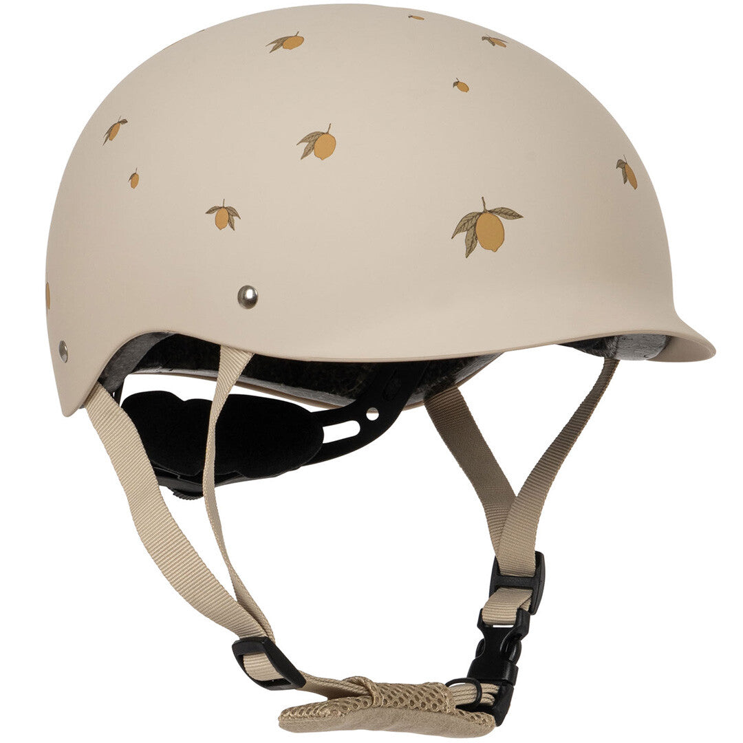 Konges Sløjd kinderhelm in beige met citroenpatroon.