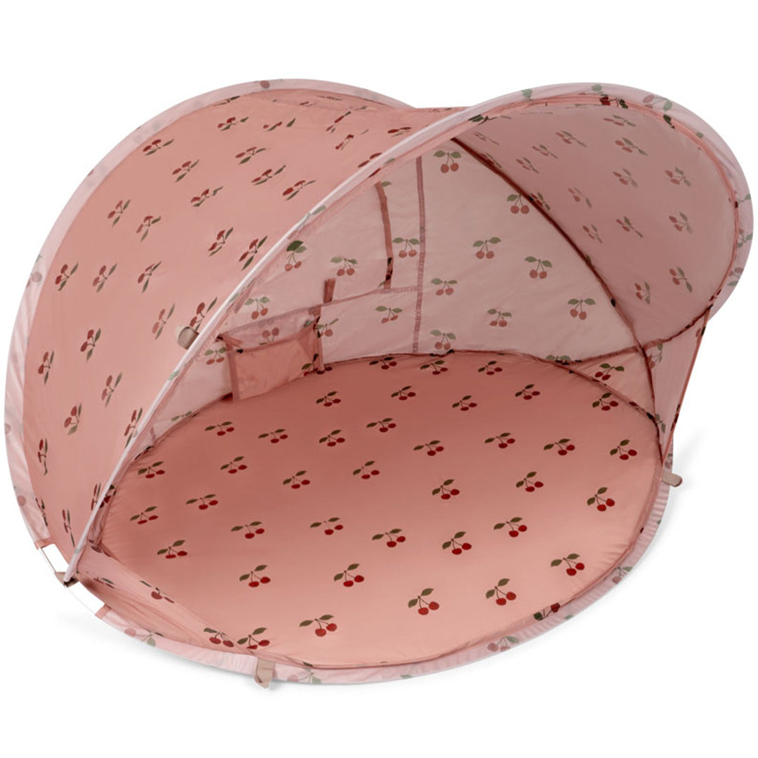 Konges Sløjd roze pop-up strandtent met kersenpatroon.