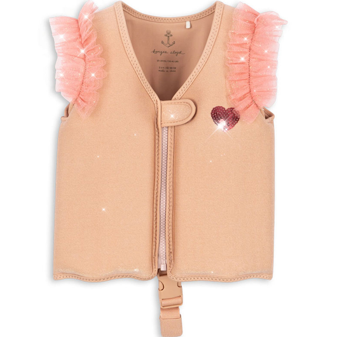 Konges Sløjd kinderzwemvest in beige met rits, een roze pailletten hartje en roze ruches aan de voorkant.