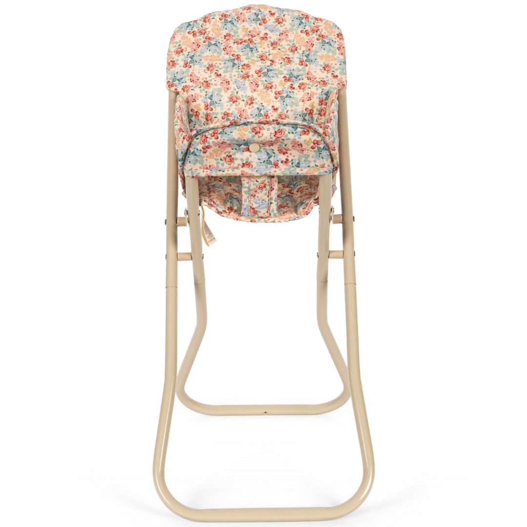 Konges Sløjd hoge poppenstoel met gebloemde stoffen zitting en beige frame, van achteren.