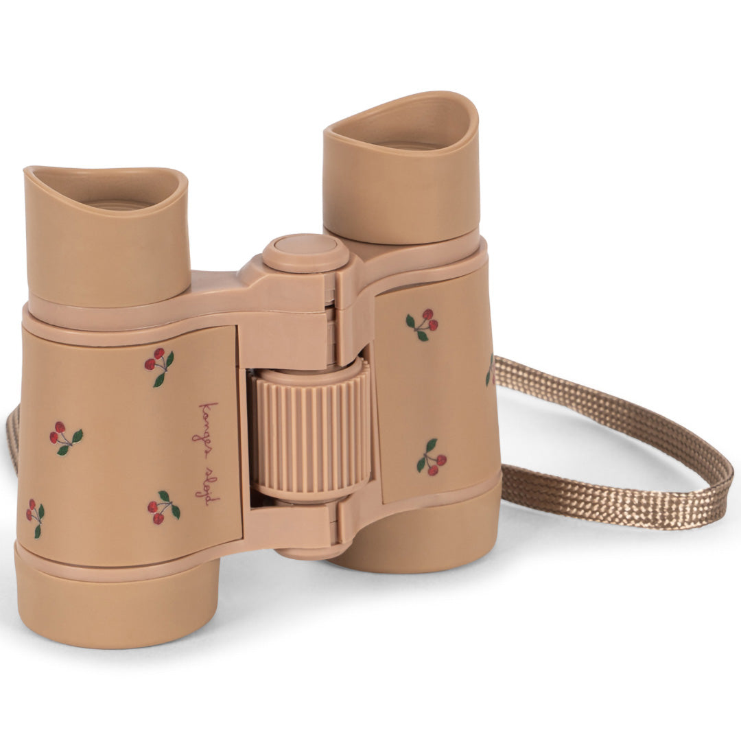 Konges Sløjd speelgoed verrekijker in beige met kersenpatroon en merknaam op de zijkant.