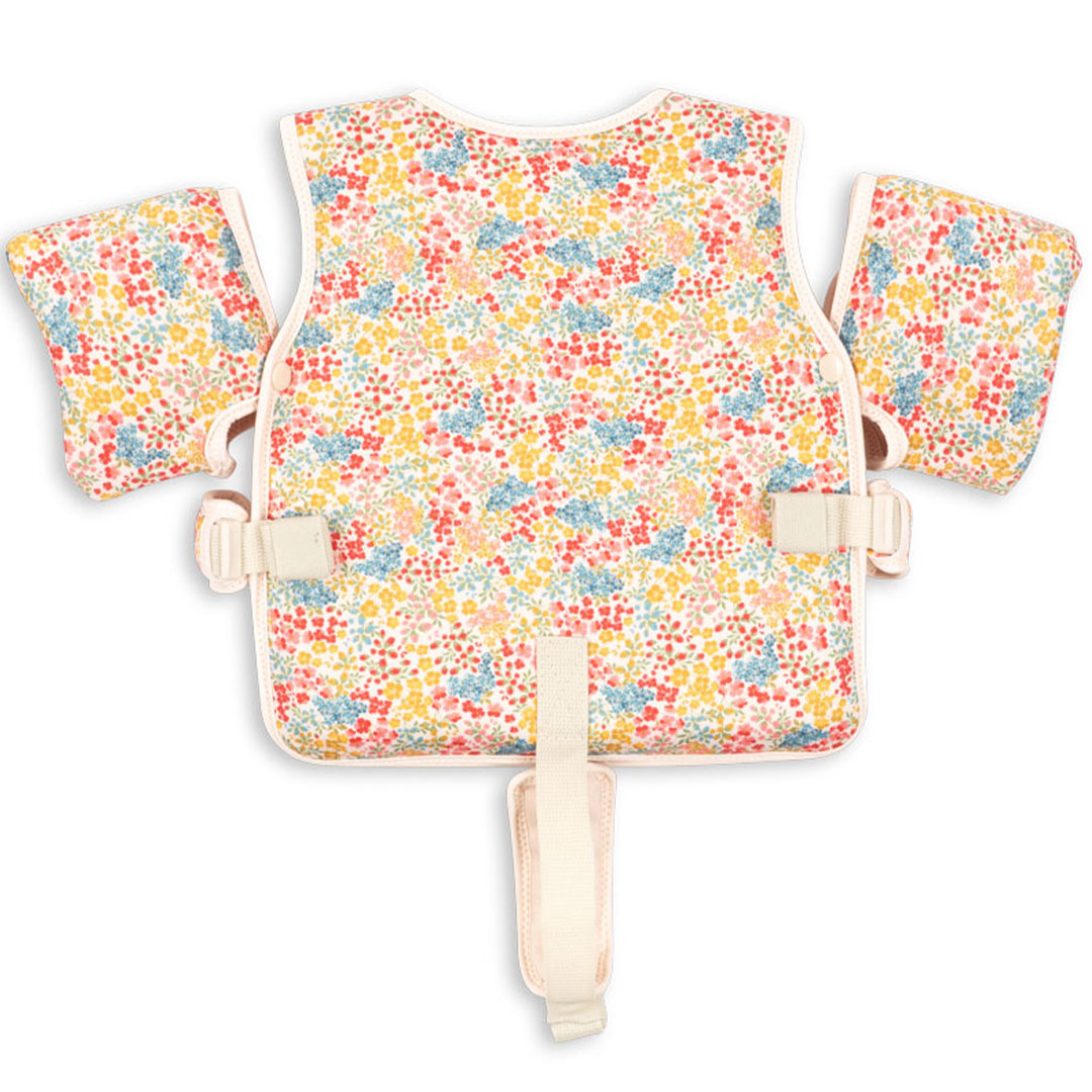 De achterkant van het gebloemde zwemvest voor kinderen met armbanden.