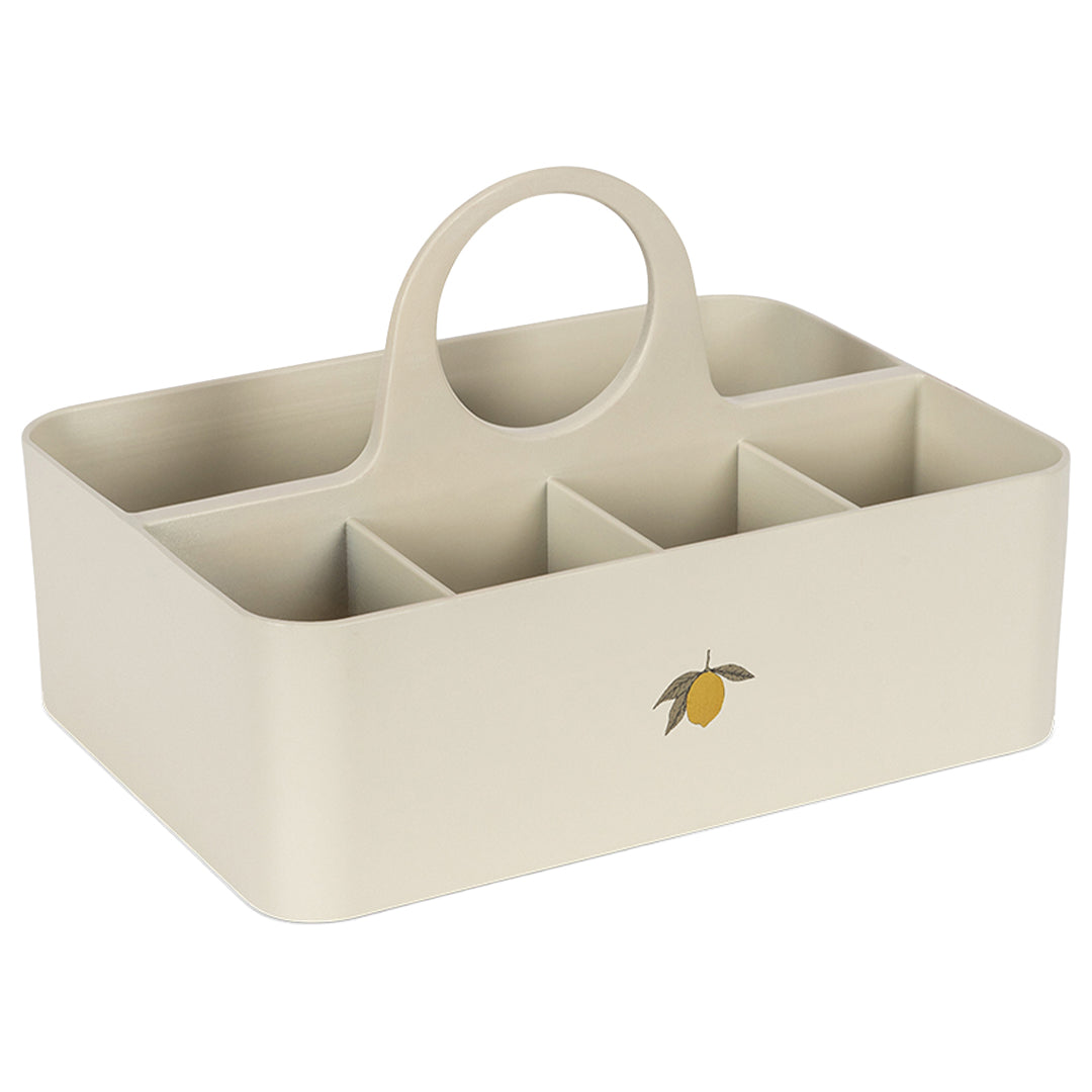 Konges Sløjd beige organizer met handvat, meerdere vakken en een citroenprint.