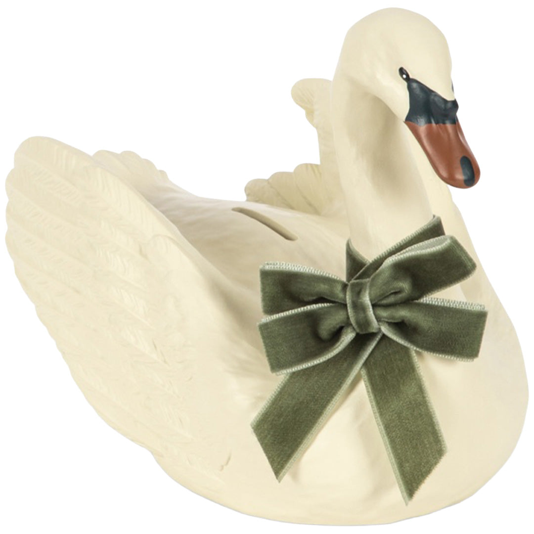 Konges Sløjd beige keramische spaarpot in de vorm van een zwaan met een groene fluwelen strik.